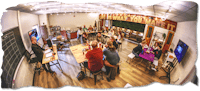 a group of people sitting around a table in a room